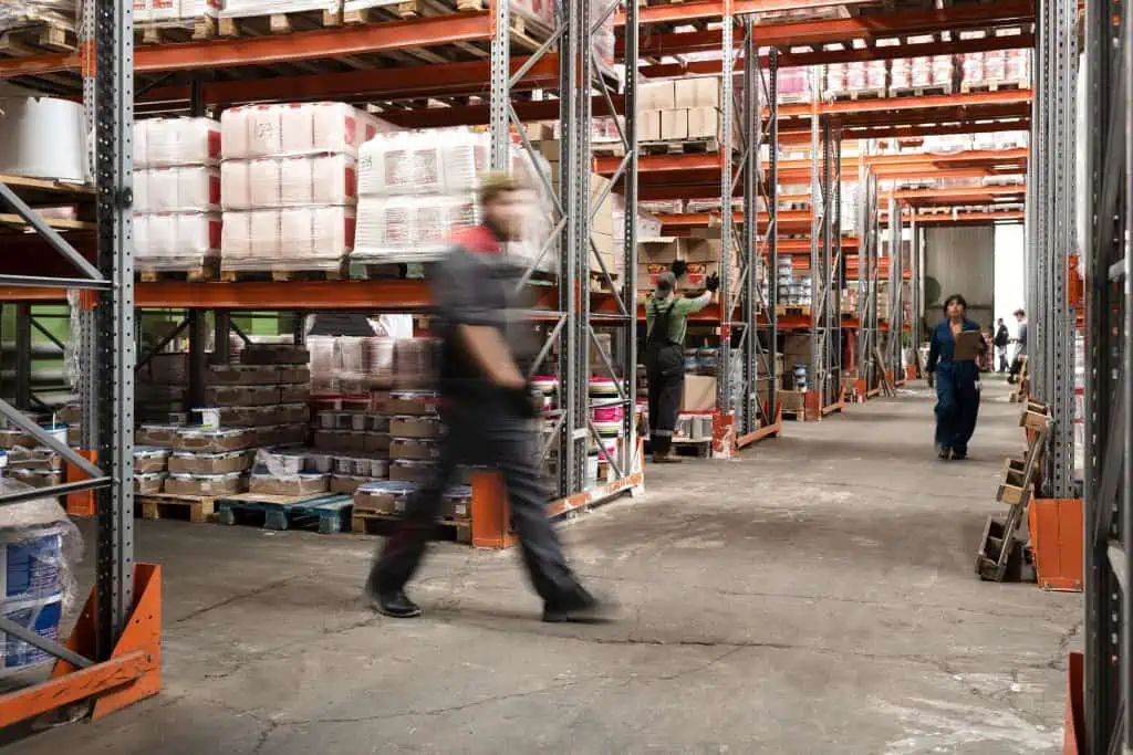 Man walking in a warehouse.