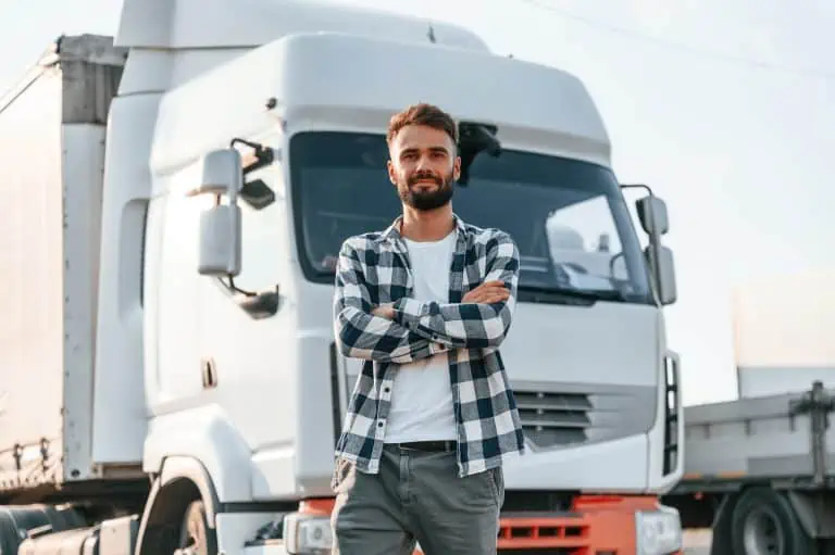 Man standing in front of a truck.